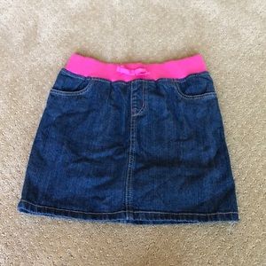 Denim skirt with pink elastic.